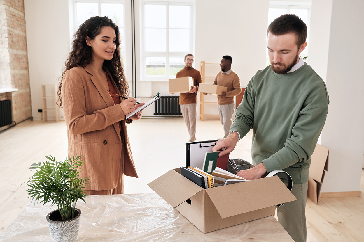 Removals team checking office equipment before a corporate relocation