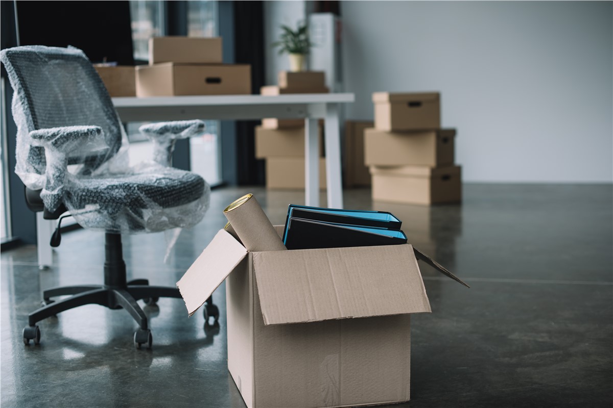 Open-box-office-supplies-folders-rolls-background-cardboard-boxes