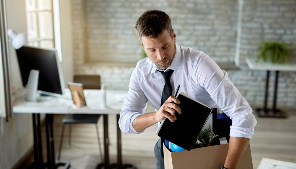 man-packing-box-for-moving-out-office